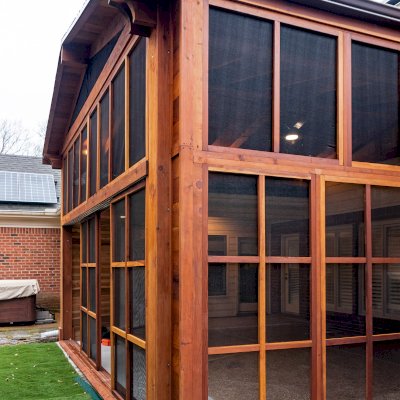 Forever Porch Pavilion (Options: 20' L x 20'-9" W, California Redwood, 2-Post Anchor Kit for High-Wind, No Electrical Wiring Trim, with 2 Fascia Boards for Gutters, 12 ft Posts Height, No Post Decorative Trims, 1 Ceiling Fan Base, No Curtain Rods, with Privacy Panels, Screened Sliding Doors and Fixed Screen Panels, Transparent Premium Sealant). Photo Courtesy of J. Pegg of Cordova, TN.